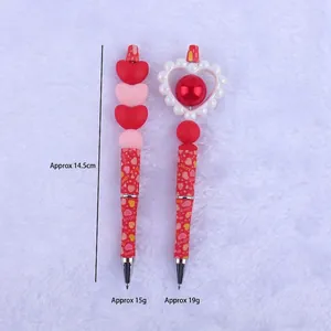 DIY Valentine silicone beaded pens with pink hearts and LOVE pattern on red barrels