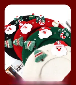 Close-up of wool Christmas berets with festive bows and decorative ornaments