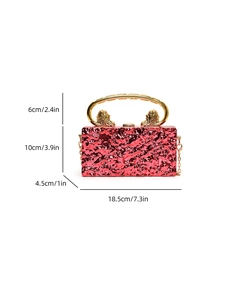 Detail view of red crackle acrylic clutch with lion head gold handle and dimensions