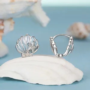 Elegant S925 sterling silver shell earrings with blue enamel and small starfish detail