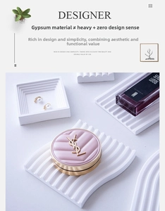 Close-up of wavy white plaster jewelry tray with fine matte texture for product display