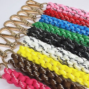 Colorful handmade braided rope keychains with golden spring metal hooks in various colors