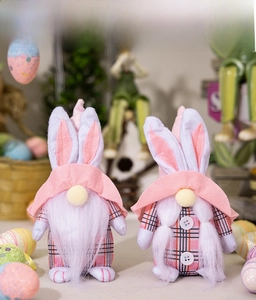 Easter gnome plush bunny dolls with pink plaid hats and braided details in a cozy scene