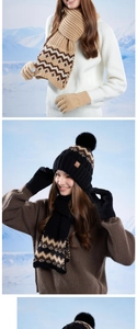 Detailed knit texture of winter warm set with bobble hat, scarf and matching gloves