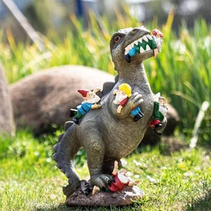Detailed resin dinosaur statue attacking garden gnomes on a natural outdoor lawn