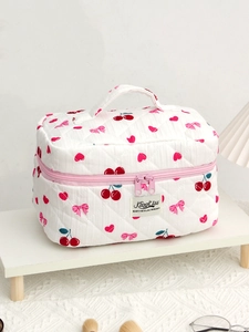 Quilted cotton makeup bag with cherry and bow pattern, rectangular vanity case with handle