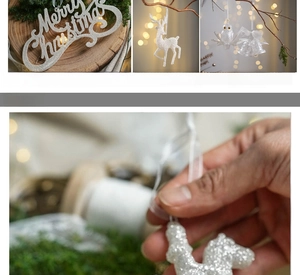Detailed view of white glitter Christmas ornaments including reindeer and bells