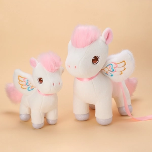 White unicorn plush toy set with pink mane and silver glitter feet on orange background