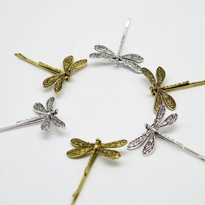 Vintage dragonfly hair clips in antique gold and silver finish with hollow-out wings