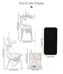 Size comparison of warm LED acrylic Christmas deer and house ornaments against a smartphone