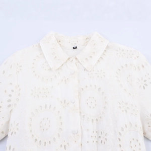 Elegant ivory white embroidered shirt dress featuring hollow-out lace patterns in cotton