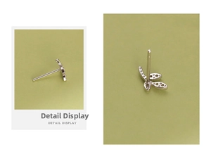 Detailed macro view of S999 sterling silver leaf earrings with sparkling cubic zirconia