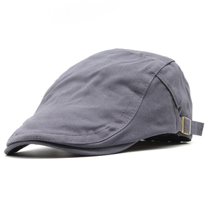 Detail of gray cotton flat cap with metal side buckle and precise stitching
