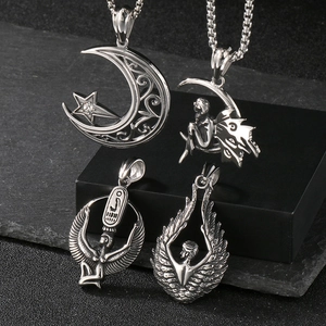 Detailed showcase of four vintage silver steel pendants with celestial and Egyptian motifs