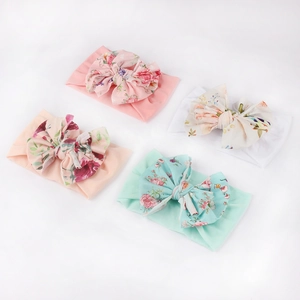 Set of 4 soft nylon baby headbands with bows in pink, beige, white and mint green