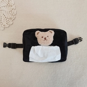 Cute black plush car tissue box cover with teddy bear embroidery on a cream rug