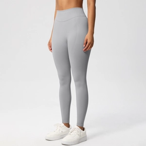 Macro detail of high-waist seamless yoga pants in light grey with premium knit texture