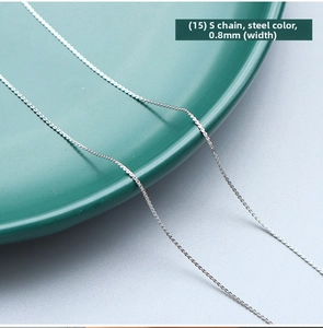 Close-up of a delicate 0.8mm steel-colored S-shaped woven chain made of titanium steel