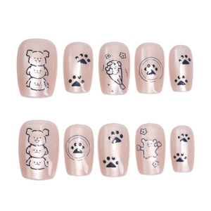 Nude pink press-on nails with cartoon puppy and cat paw prints in pearlescent finish