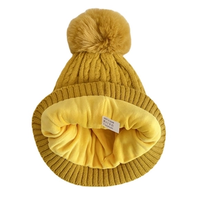 Ginger yellow knitted beanie with large pompom and thick fleece lining for winter warmth