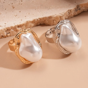 Elegant irregular faux pearl ring with gold and silver lava texture bands on stone