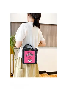 Street style girl wearing a creative oil tank crossbody bag with glitter embroidery