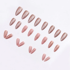 Sparkly rose gold and pink stiletto press-on nails with glitter and gold line art