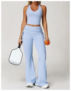 Detail of light blue high-waisted flare leggings with side drawstring ruched accents