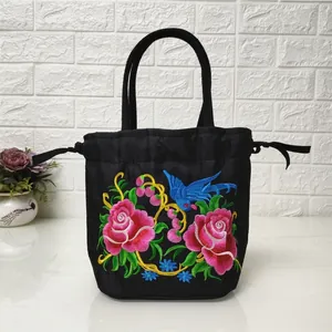 Ethnic embroidered canvas bucket bag with floral bird patterns and drawstring closure