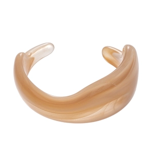 Retro marble acrylic C-shaped open bangle featuring warm almond color and irregular geometry