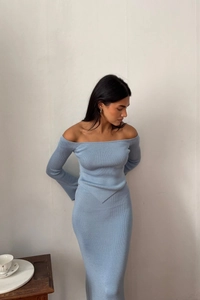 Close-up of light blue ribbed knit fabric texture on off-shoulder top and skirt set