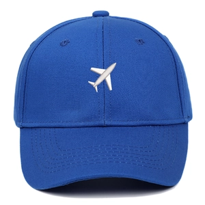 Blue cotton baseball cap with white airplane embroidery on a clean white background