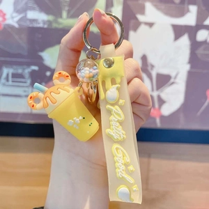 Portachiavi a tazza di gelato giallo con ciondolo a ciambella e cinturino in silicone
