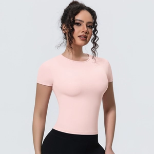 Close-up of pink slim fit yoga t-shirt with crew neck and breathable stretch fabric