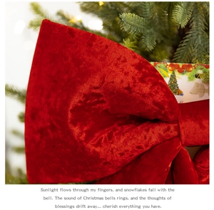 Close-up of a large red velvet Christmas bow featuring rich texture and festive lighting