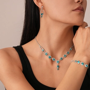 Close-up of blue crystal necklace set worn by model for elegant formal occasions