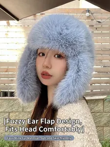 Light blue faux mink fur trapper hat with ear flaps for winter skiing and cold protection