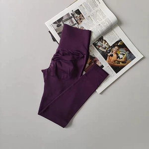 Detailed view of high-waist purple yoga leggings with scrunch butt lifting texture