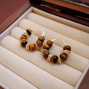 Retro tiger eye beaded hoop earrings with gold plated accents in a luxury jewelry box