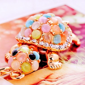 Turtle keychain with opal gemstones and sparkling rhinestones in gold-plated finish