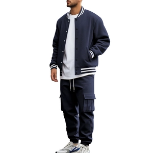 Men's navy blue varsity jacket and cargo sweatpants set shown on a model on white background
