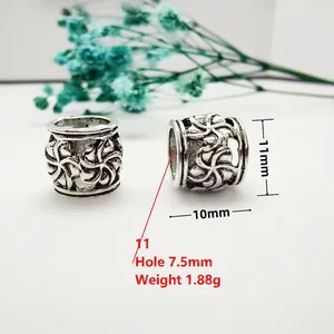 Detailed view of antique silver hollow floral spacer beads with 7.5mm large hole