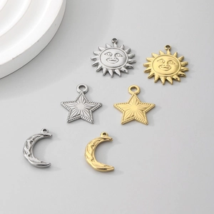 Macro view of gold and silver sun star moon stainless steel pendant accessories
