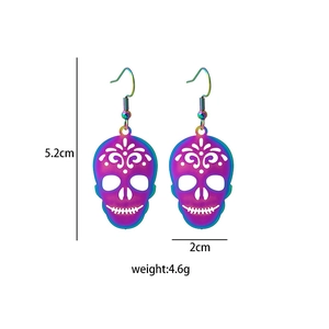 Detailed view of skull earrings featuring iridescent colorful plating and size metrics