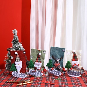 Detailed view of four plaid Christmas stockings featuring Santa, Bear, Elk and Snowman characters