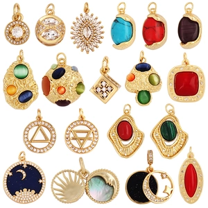 Collection of gold plated brass pendants with zircon and turquoise in celestial designs