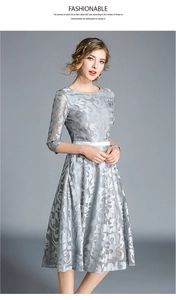 Detail of the high-quality grey lace fabric and floral embroidery on this dress