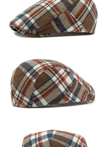Detail view of vintage plaid ivy cap fabric with wool texture and metal side buckle