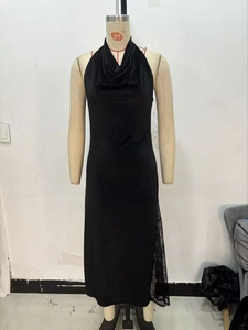 Detail view of black velvet midi dress with halter neck and delicate lace hem stitching