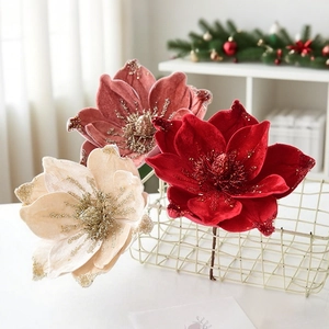 Artificial velvet Christmas magnolia flowers with glitter petals in a basket for tree decor